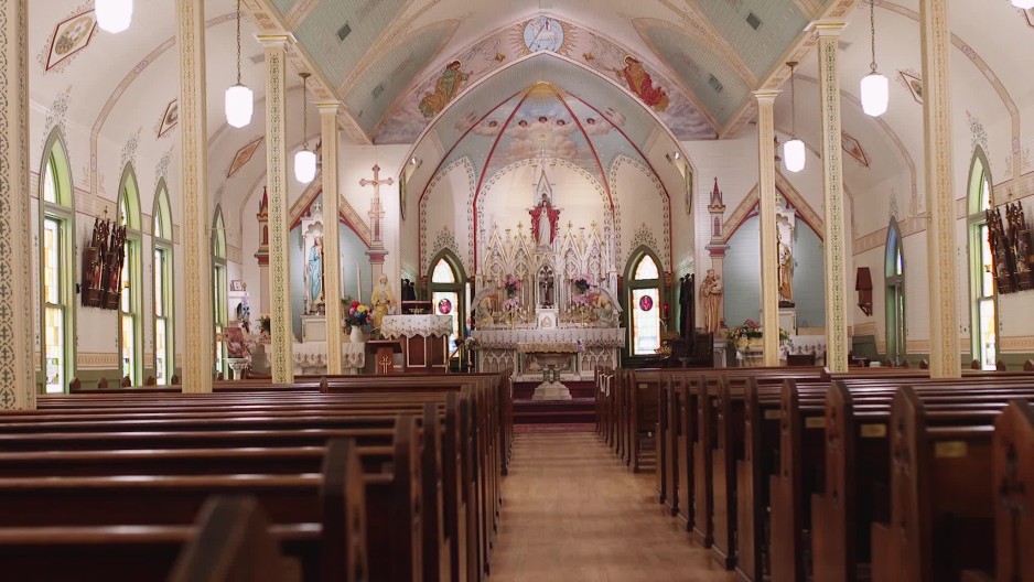 Moving right into center aisle of St Marys Catholic Church in
