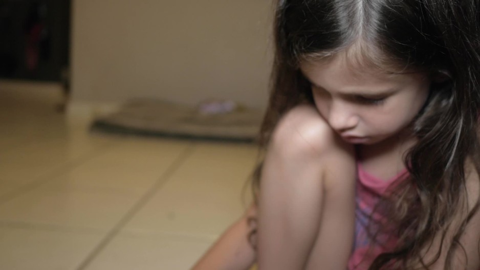 little girl playing with her toys on the floor | ClipStock  
