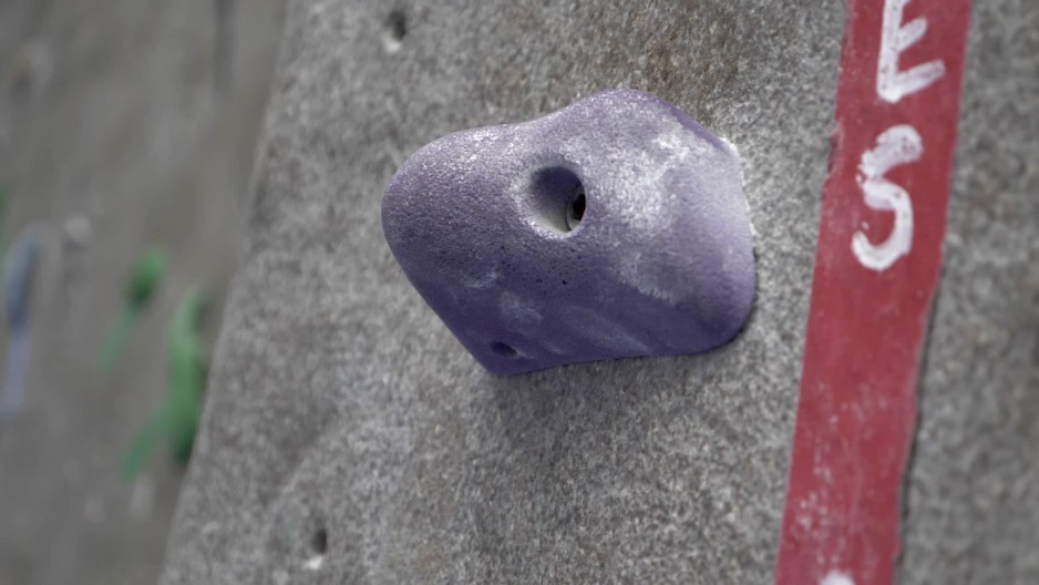 Moving close up shot of rock climbing peg indoors slow motion ClipStock