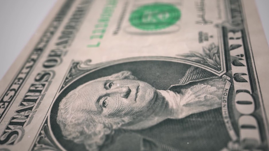 One dollar bill banknote motion into focus president