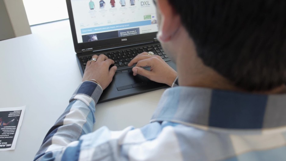 Slide right to OTS of man working on laptop | ClipStock