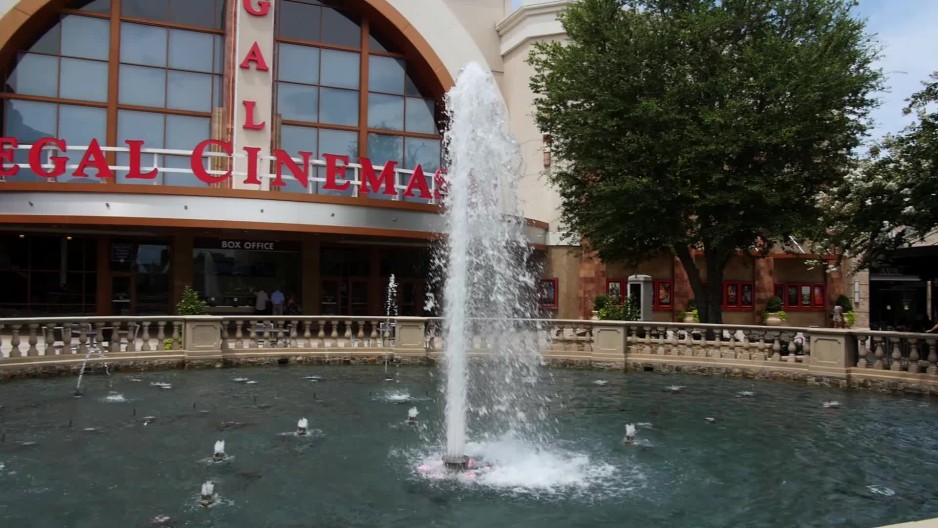water fountain in front of movie theater in downtown alpharetta