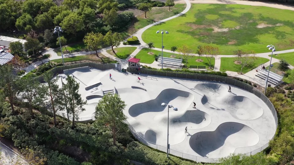 kids riding scooters at a skate park in Ladera Ranch California ClipStock