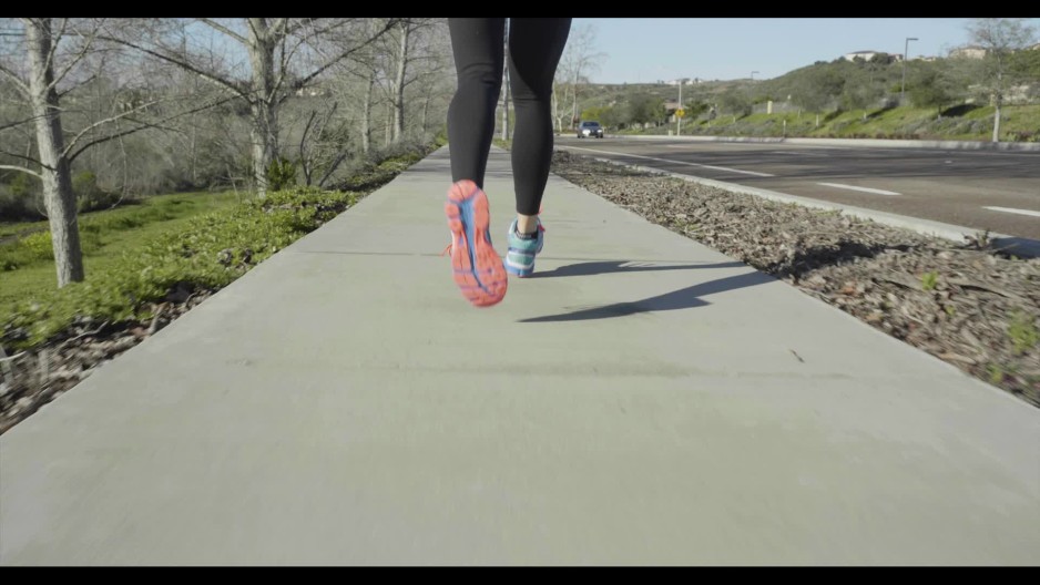 close up of woman jogging running slow motion ClipStock