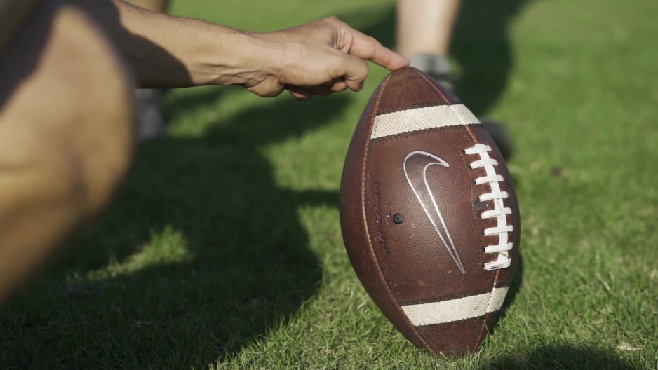 football being kicked for field goal slow motion ClipStock