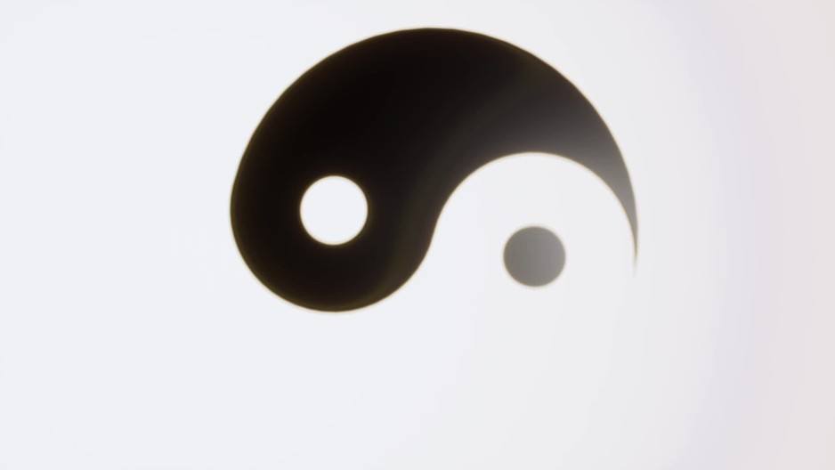 Spinning Yin and Yang symbol behind white background Slow Motion
