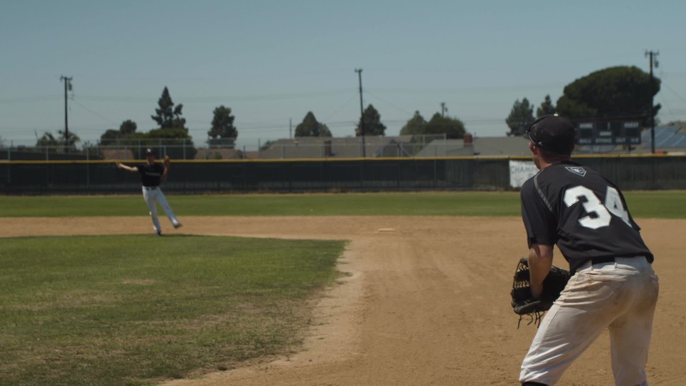 first and second baseman on high school baseball team practice catching