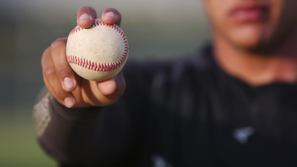 Close Up Of Baseball Player Holding Up Baseball To Camera Clipstock Close Up Of Baseball Player Holding Up Baseball To Camera Clipstock