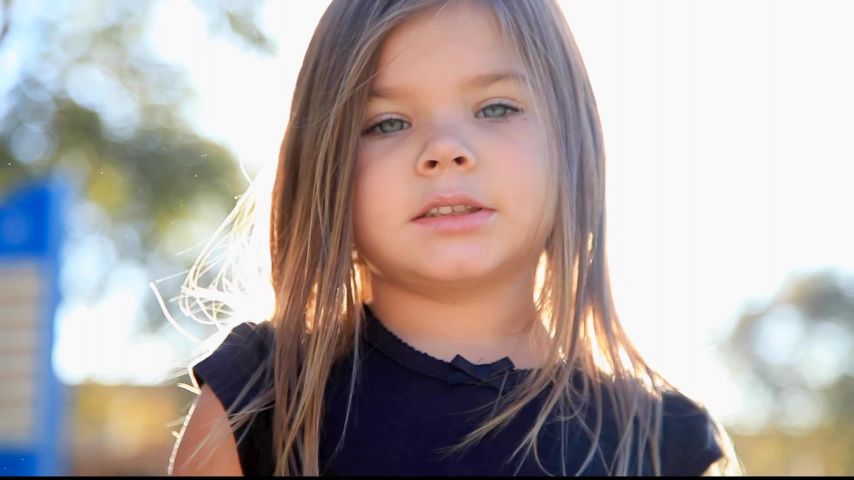 Little Girl Eating And Making Funny Faces At Camera Clipstock