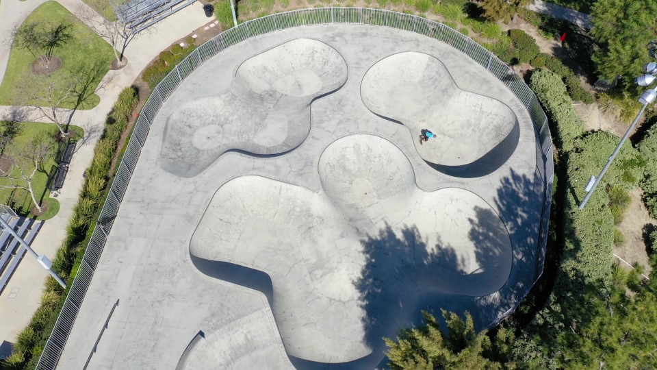 kids riding scooters at a skate park in Ladera Ranch California ClipStock