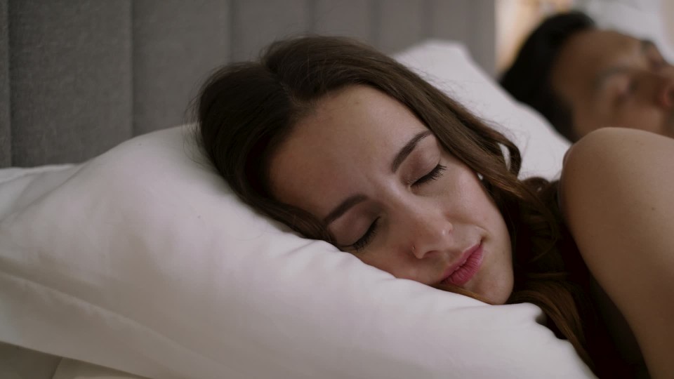 Tired Beautiful Woman Turning Of The Alarm Waking Up Sleeping Husband Clipstock