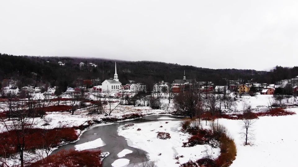 Snow field next to building during winter in Hartford Vermont aerial