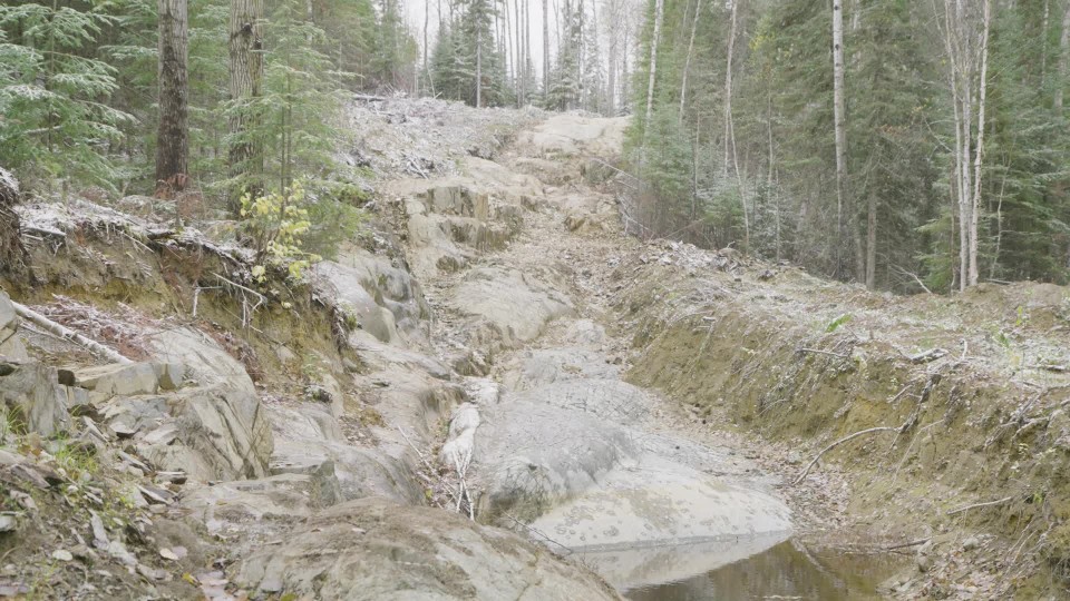 The City of Beardmore sign beside a large inflatable snowman in