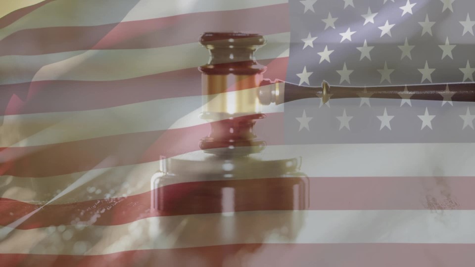 Judge gavel coming down hitting multiples times marble table top view