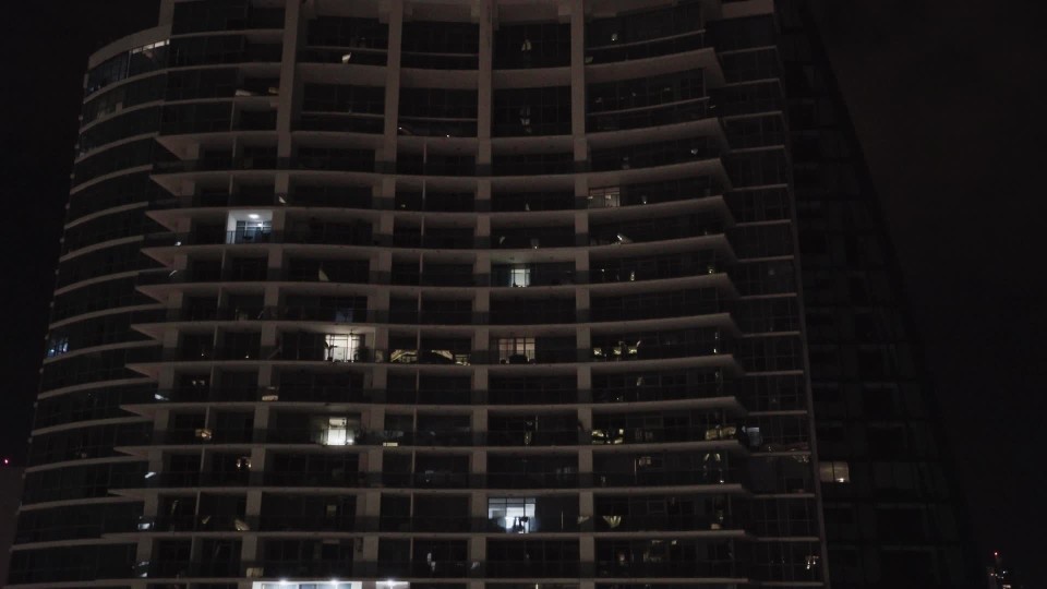 View From Hotel Balcony Of High Rise Building And Panama City Skyline Along Coast At Night Clipstock