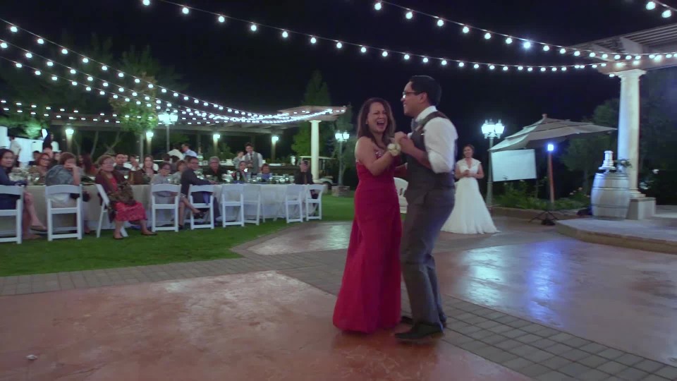 young filipino groom dancing with his mom for the mother son dance at