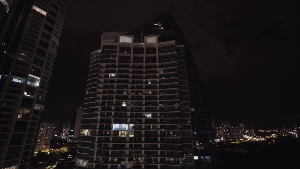 View From Hotel Balcony Of High Rise Building And Panama City Skyline Along Coast At Night Clipstock