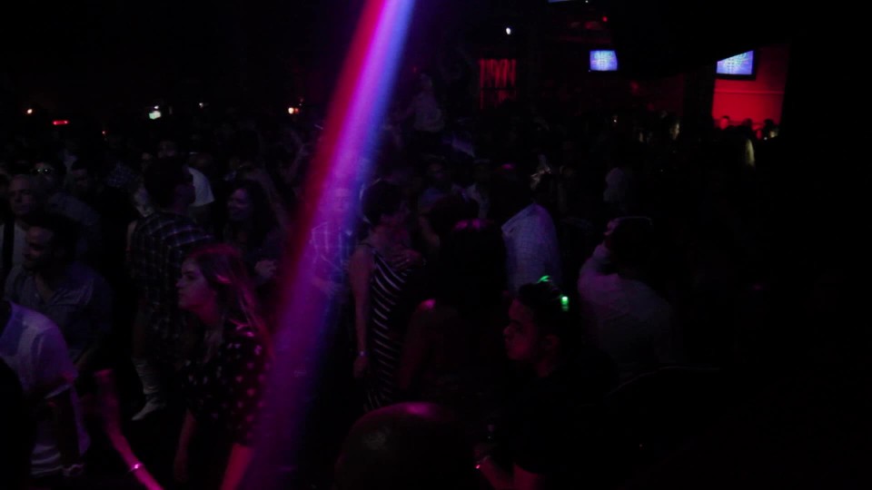 foggy packed dancefloor in night club ClipStock